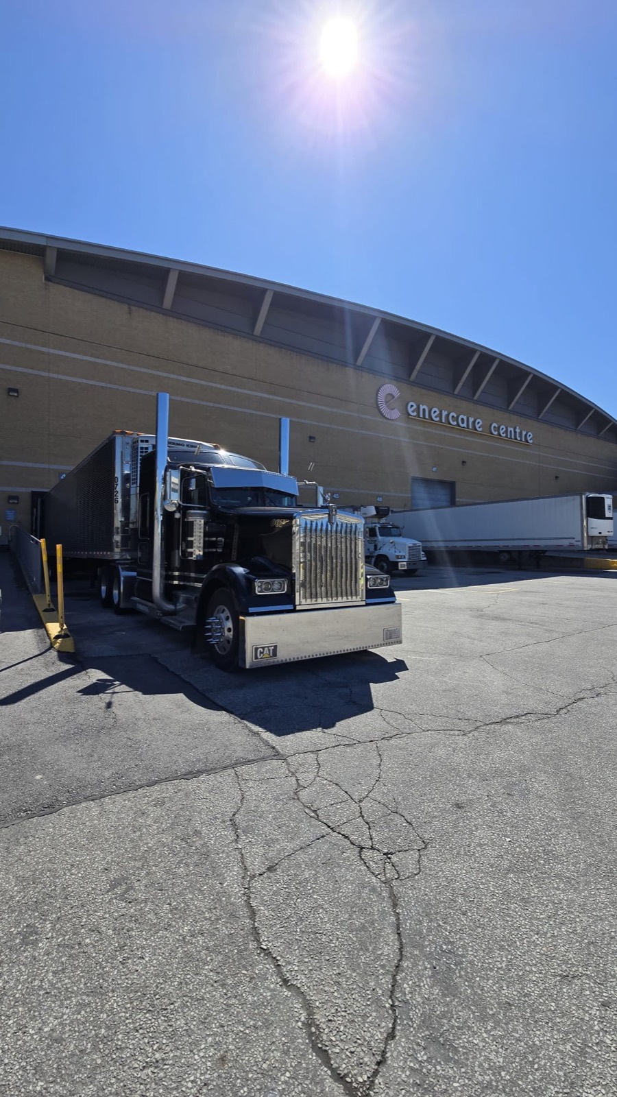 An Airfield Trucking Kenworth and reefer trailer parked on a sunny day